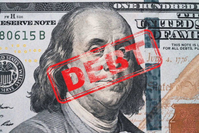 Hundred dollar bill with red debt stamp