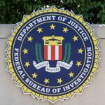 FBI seal featuring stars and laurel leaves