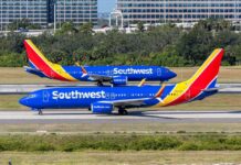 Two Southwest Airlines planes on an airport runway
