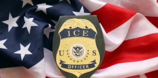 ICE officer badge placed on an American flag