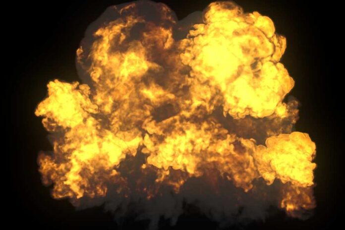 shutterstock_745883173.jpg A large explosion with flames and smoke against a dark background