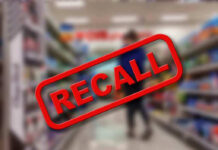 Recall stamp on blurred store aisle background.