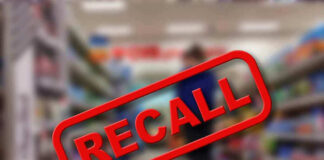 Recall stamp on blurred store aisle background.