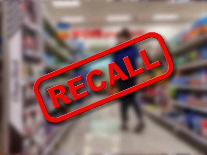 Recall stamp on blurred store aisle background.