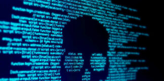 Skull silhouette in blue computer code background.