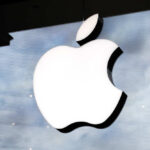 Apple BOMBSHELL — New Era Begins Illuminated Apple logo on a glass storefront