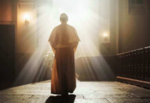 American Pope’s Easter Message Sparks Controversy Person in religious attire bathed in sunlight.