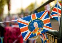 King Charles Addresses Congress During Independence Anniversary A decorative banner celebrating the coronation of King Charles III with British flags