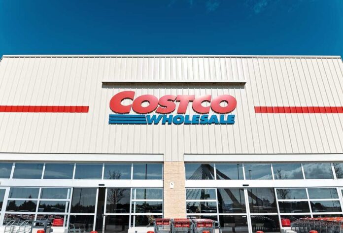 Exterior view of a Costco Wholesale store with shopping carts in front