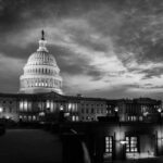 Senator’s Dead Daughter Demanded He Do This U.S. Capitol building at dusk, black and white photograph.