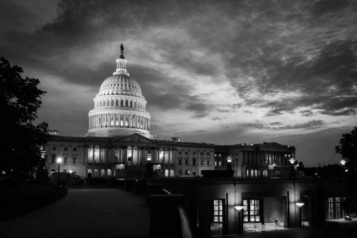 U.S. Capitol building at dusk, black and white photograph.