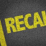 RECALL: Walmart Pulls Dangerous Product Yellow 'RECALL' text on a dark asphalt surface