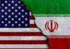 Explosive Warning: US Troops in Iran = U.S. Revolution A cracked surface displaying the flags of the USA and Iran