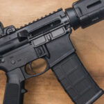 VIDEO: MARINE Veteran Stops Gunman Black rifle on wooden surface close up