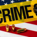 Masked Gunmen UNLEASH Hell – 23 Shot A gun and bullets on an American flag with a crime scene marker