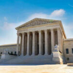 Supreme Court BOMBSHELL – Redistricting Chaos U.S. Supreme Court building exterior under blue sky.