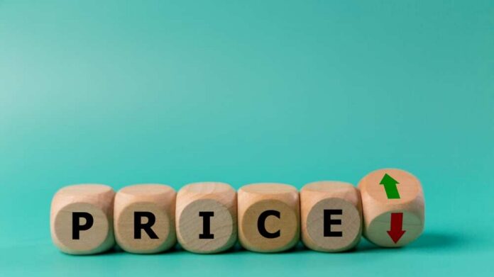 Wood,Block,With,Symbols,Of,Growth,And,Decline,Near,The Wooden blocks spelling 'PRICE' with arrows indicating increase and decrease