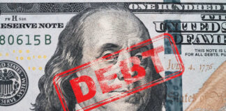 Hundred dollar bill with red debt stamp