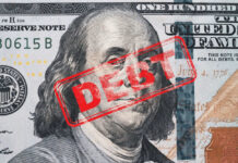 Hundred dollar bill with red debt stamp