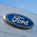 Ford’s Big Move — Blue-Collar Buyers Applaud Ford logo on a buildings exterior wall