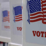 Election Rules Ripped From White House Voting booths with American flags and VOTE signs.
