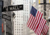 Spy Chief Shake-Up: Wall Street Lawyer? Street signs for Wall Street and Broad Street with American flags in the background