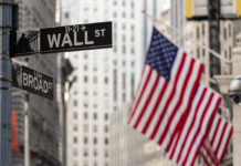 Spy Chief Shake-Up: Wall Street Lawyer? Street signs for Wall Street and Broad Street with American flags in the background