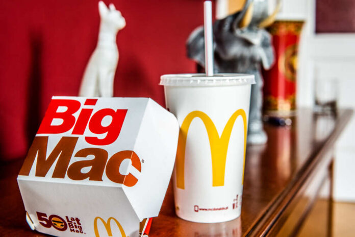 Warsaw,,Poland,,July,22,,2018,Mcdonald's,Big,Mac,With,Two A Big Mac box and a McDonald's drink on a wooden table