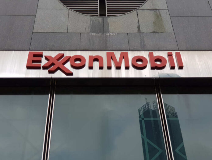 ExxonMobil logo displayed on a glass building