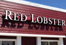 Iconic Red Lobster Restaurant Shuttered Signage of Red Lobster restaurant against a blue sky