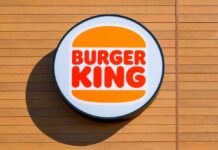 Burger King logo displayed on a wooden wall