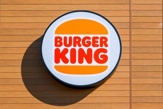 Otloczyn,,Poland,-,June,3,,2022:,Logo,Of,The,Fast Burger King logo displayed on a wooden wall