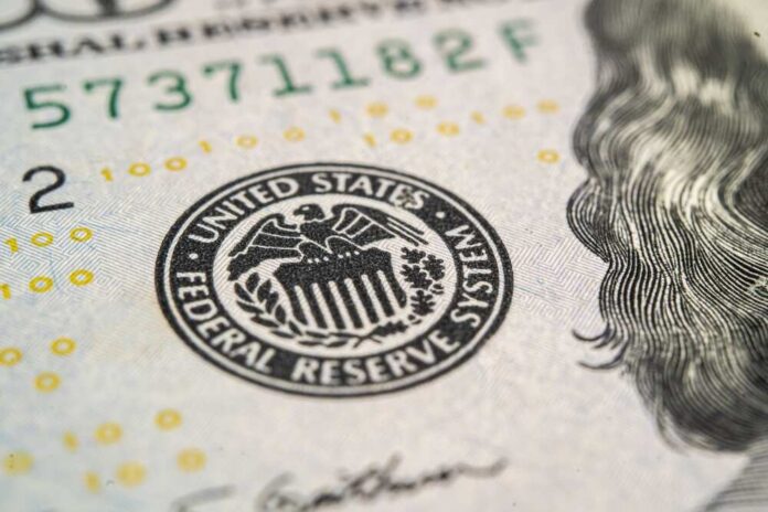 The,Federal,Reserve,System,,The,Central,Banking,System,Of,The Close-up of a United States dollar bill featuring the Federal Reserve emblem