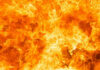 VIDEO: Paradise Inferno Stuns Tourists Bright orange and yellow flames burning intensely.