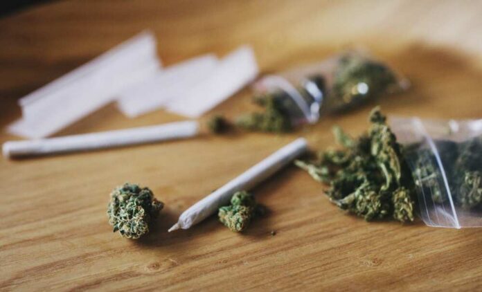 Cannabis,,Buds,And,Blunt,On,Drug,Table,,Weed,And,Thc Marijuana