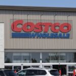 Exterior view of a Costco Wholesale store with a clear blue sky