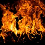 Bright flames dancing against a dark background