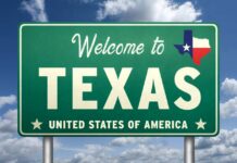 Welcome sign for Texas with the state flag