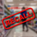 CHOKING Alert Hits Top Retailers Recall stamp on blurred store aisle background.
