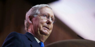 Mitch McConnell at a podium speaking.