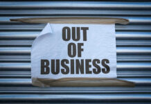 Pet Chain Shrinks — What Spooked Wall Street? Out of Business sign on closed store shutters.