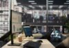 Computer monitor with analytics dashboard in a modern open office