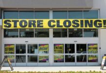 Corner Store Icon Vanishes: 645 Closures Coming Storefront with a large 'STORE CLOSING!' banner and sale signs