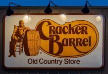 Cracker Barrel Backlash Claims The Boss Cracker Barrel restaurant sign featuring a seated figure and a barrel