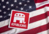 Republican party logo on American flag background.