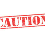 ALERT: Brake Disaster Looms On 21,000 Red caution sign with grunge texture diagonal