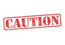 ALERT: Brake Disaster Looms On 21,000 Red caution sign with grunge texture diagonal