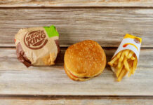 Burger King Dethrones Wendy’s — What Broke? Burger King hamburger and fries on a wooden surface