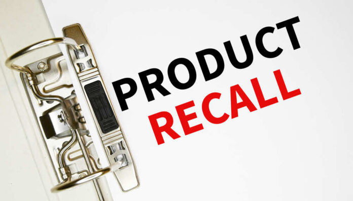 Product,Recall,On,A,Paper,In,A,Folder.,Refund,And A binder clip holding a sheet of paper with the words 'PRODUCT RECALL' printed in bold letters