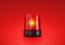 Red Flag Panic — Guard Mobilized Red emergency light on red background